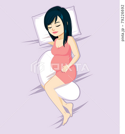 Young Asian pregnant woman sleeping on bed with pillow between legs Young Asian pregnant woman sleeping on bed with pillow between legs 79226692