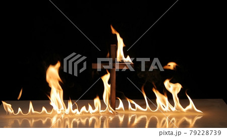 Fire around a burning cross symbol 79228739