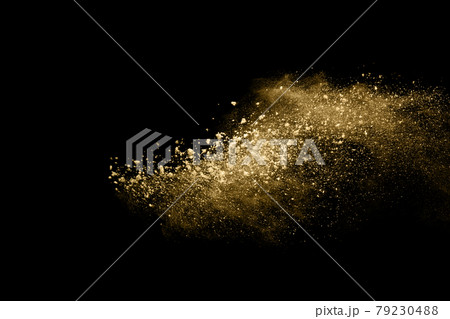 Golden powder explosion on black background. Freeze motion. 79230488