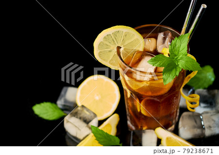 Glass of Fresh Long Island Ice Tea Cocktail - studio shot on black background Glass of Fresh Long Island Ice Tea Cocktail - studio shot on black background 79238671