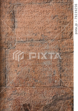 Ancient inscriptions stone wall in ancient Tamil language Ancient inscriptions stone wall in ancient Tamil language 79239256