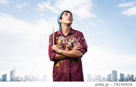 Young painter artist standing with folded arms Young painter artist standing with folded arms 79240956
