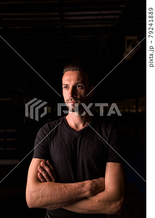 Portrait of handsome man thinking at night in parking lot building 79241889