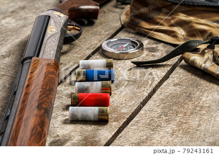 Various hunting equipment on old wooden background Various hunting equipment on old wooden background 79243161