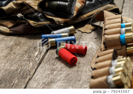 Various hunting equipment on old wooden background 79243307