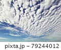 Altocumulus and Cirrocumulus, Small clouds spread across the blue sky. Skyscape background. 79244012