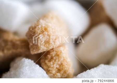 Brown and white sugar cubes background. Close up 79244866