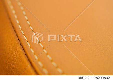 Leather upholstery for the motorcycle seat close-up. Leather upholstery for the motorcycle seat close-up. 79244932