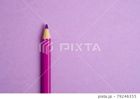 Pink pencil on pink paper background. Close up. 79246355
