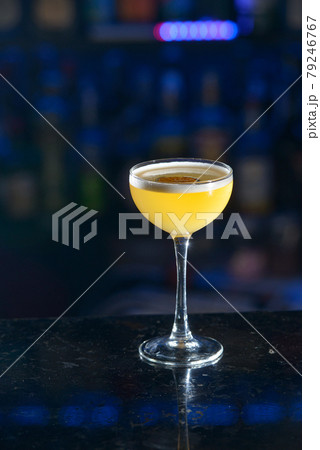 yellow refreshing coctail on a bar desk yellow refreshing coctail on a bar desk 79246767