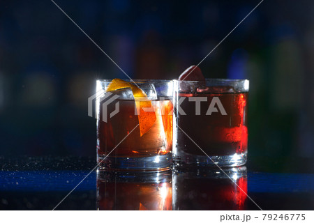 glasses of cold fresh summer strawberry and orange coctails on a table glasses of cold fresh summer strawberry and orange coctails on a table 79246775