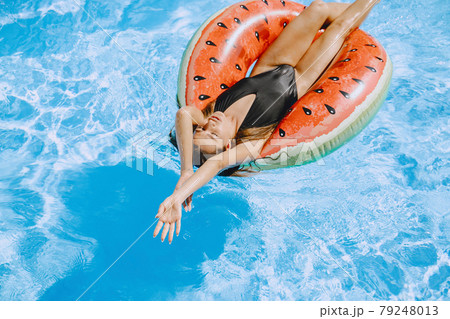 Beautiful and elegant girl on a resort 79248013