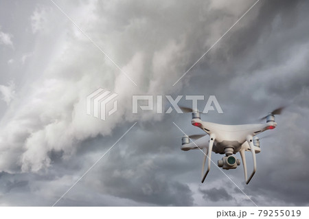 UAV drone copter flying with digital camera. UAV drone copter flying with digital camera. 79255019