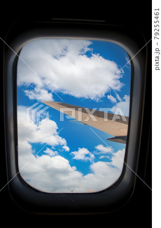 Skyscape through aero plane window during flight Skyscape through aero plane window during flight 79255461