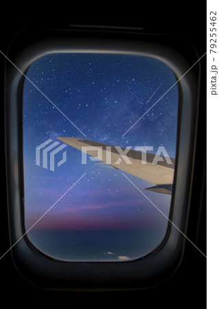Skyscape through aero plane window during flight Skyscape through aero plane window during flight 79255462