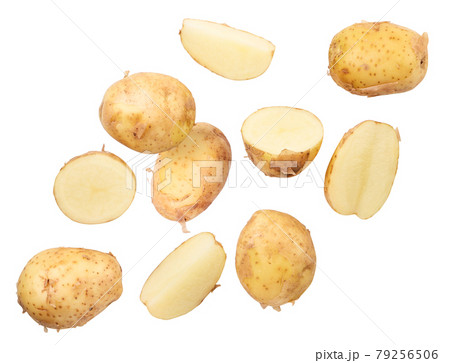 Young unpeeled potatoes whole and pieces fly on a white background. Isolated Young unpeeled potatoes whole and pieces fly on a white background. Isolated 79256506