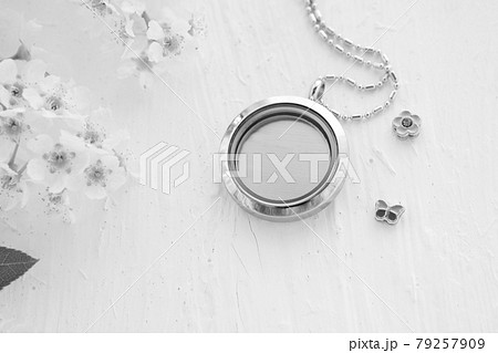 Silver necklace for her shining on white with white flowers. Luxury silver jewelry chains with glass and crystals. Small Beautiful precious metal present for woman. Luxury expressions 79257909