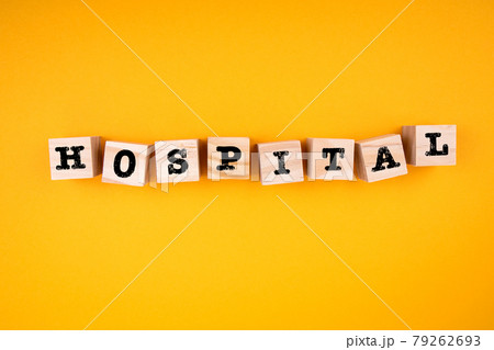 Hospital. Wooden cubes with text on a yellow background 79262693