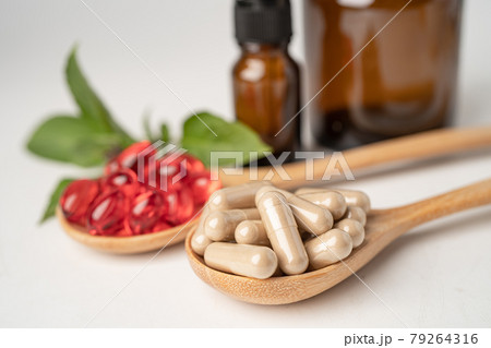 Alternative medicine herbal organic capsule with vitamin E omega 3 fish oil, mineral, drug with herbs leaf natural supplements for healthy good life. Alternative medicine herbal organic capsule with vitamin E omega 3 fish oil, mineral, drug with herbs leaf natural supplements for healthy good life. 79264316