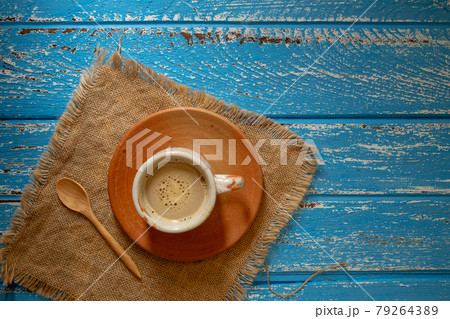 Cup of hot coffee in the morning on a blue rural wooden table 79264389