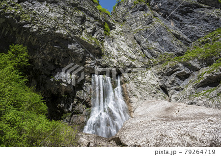 Geghsky waterfall in the mountains of the Republic of Abkhazia. Clear sunny day May 14, 2021 Geghsky waterfall in the mountains of the Republic of Abkhazia. Clear sunny day May 14, 2021 79264719