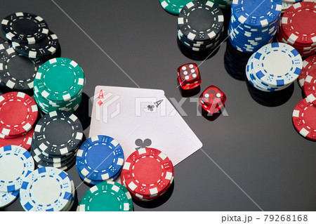 Casino chips, playing cards and dices on dark reflective background Casino chips, playing cards and dices on dark reflective background 79268168