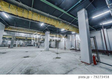 Construction of spacious well-lit underground car park with parking spaces. Empty parking garage underground, industrial interior 79273458