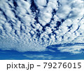 Altocumulus and Cirrocumulus, Small clouds spread across the blue sky. Skyscape background. 79276015