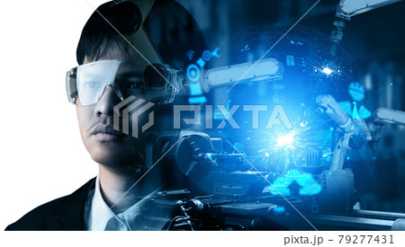 Mechanized industry robot arm and factory worker double exposure 79277431