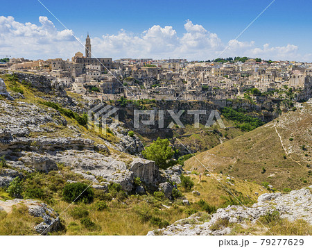 Dramatic view of the ancient town of Matera and its deep canyon, Basilicata region, southern Italy 79277629