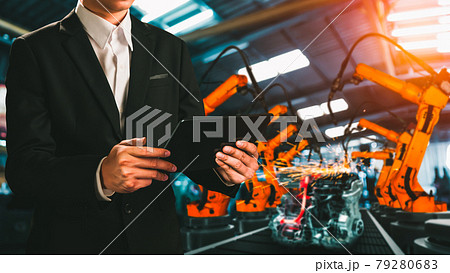 Engineer use advanced robotic software to control industry robot arm in factory Engineer use advanced robotic software to control industry robot arm in factory 79280683