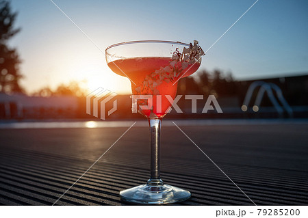 hemingway daiquiri cocktail drink with grapefruit in glass outdoor at sunset 79285200