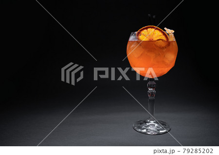 fresh orange aperol spritz mango cocktail with ice in glass on black background 79285202