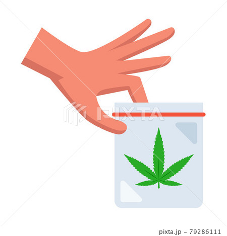 man holds a packet of marijuana in his hand. 79286111
