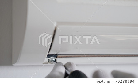 Technician service checking and repair air conditioner house indoors on the wall Technician service checking and repair air conditioner house indoors on the wall 79288994