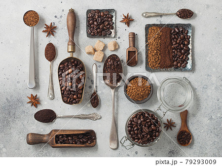 Freeze dried instant coffee granules with ground coffee and beans in various spoons and scoops Freeze dried instant coffee granules with ground coffee and beans in various spoons and scoops 79293009
