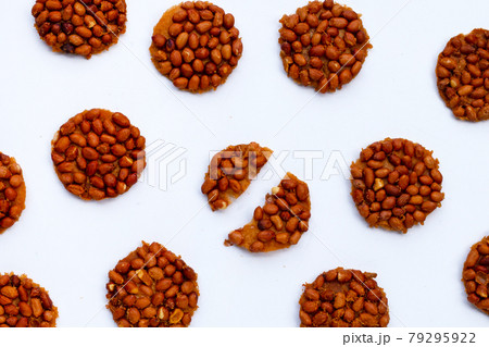 Fried peanut cookies on white background. Fried peanut cookies on white background. 79295922