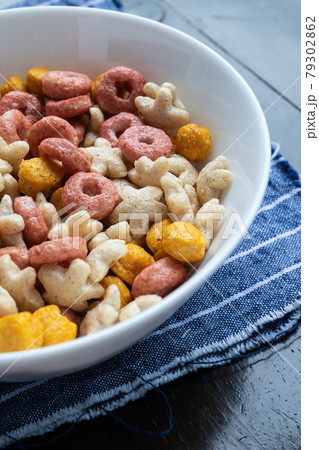 Colored cereals in a white bowl 79302862