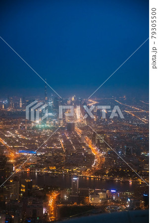 Night Aerial View Of Dubai Cityscape Skyline. Top View Skyline Cityscape City In Night Illuminations. Dubai, United Arab Emirates 79305500