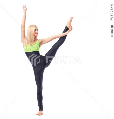 Attractive female gymnast exercising at studio Attractive female gymnast exercising at studio 79307644