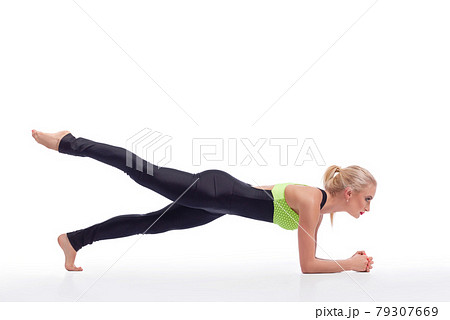 Attractive female gymnast exercising at studio Attractive female gymnast exercising at studio 79307669