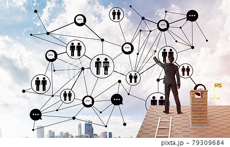Businessman on house roof presenting networking and connection concept. Mixed media 79309684