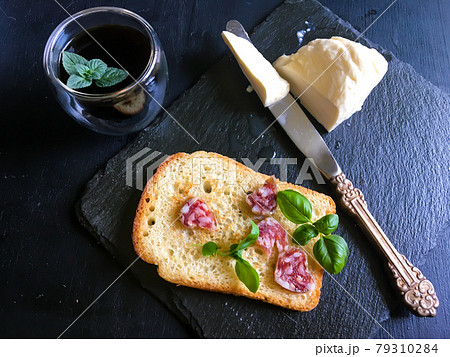 A delicious and hearty classic breakfast. Fresh coffee with mint leaf, young basil leaves and the freshest mozzarella A delicious and hearty classic breakfast. Fresh coffee with mint leaf, young basil leaves and the freshest mozzarella 79310284