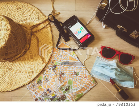 Travelling things which can be useful at any trip: camera, map, mask, hat Travelling things which can be useful at any trip: camera, map, mask, hat 79310353