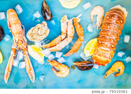 Fresh seafood on blue background 79310361