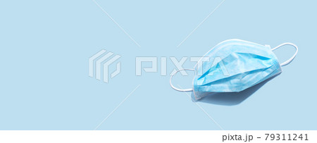 Blue surgical mask overhead view 79311241