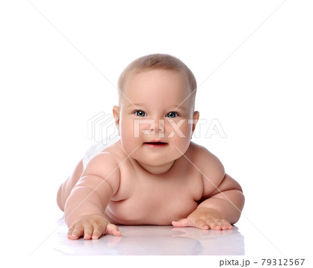 Infant child baby girl kid in diaper lying happy 79312567
