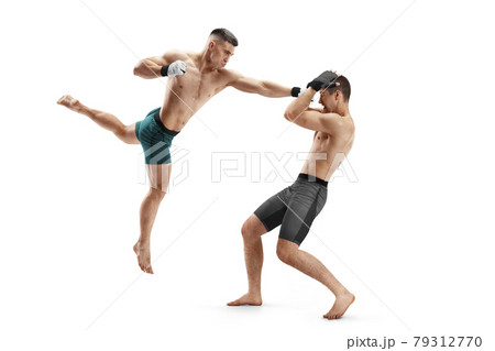 Punch in MMA. Two fighters are fighting. Hand kick. Sport action concept. Isolated Punch in MMA. Two fighters are fighting. Hand kick. Sport action concept. Isolated 79312770