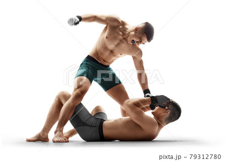 MMA. Ground and pound. Two fighters are fighting. Punches. Sport concept. Emotions of winner. Isolated MMA. Ground and pound. Two fighters are fighting. Punches. Sport concept. Emotions of winner. Isolated 79312780