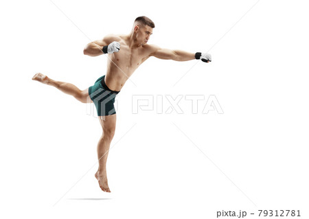 MMA kick. Straight punch. Sport concept. MMA fighter isolated on white background. Athlete MMA kick. Straight punch. Sport concept. MMA fighter isolated on white background. Athlete 79312781